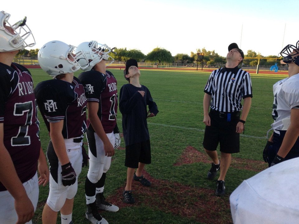 Max is “Honorary Capt” & wins coin toss at Mountain Ridge Game
