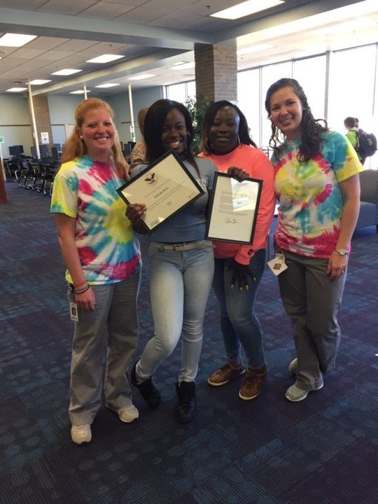 Project Au Some 6th grader, Kaliyah, receiving the President’s Volunteer Service Award