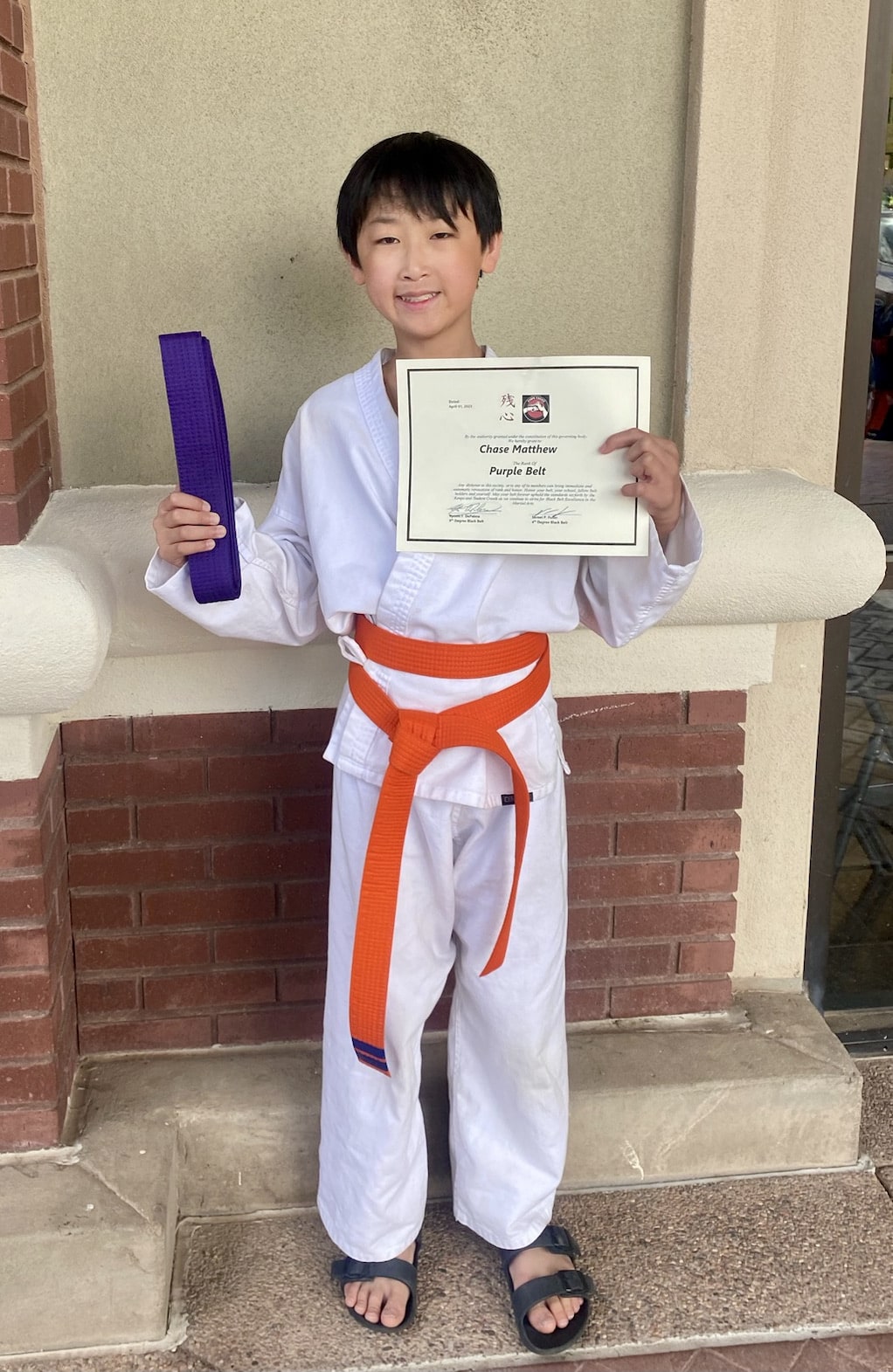 Chase obtains his purple belt!  Go Chase!