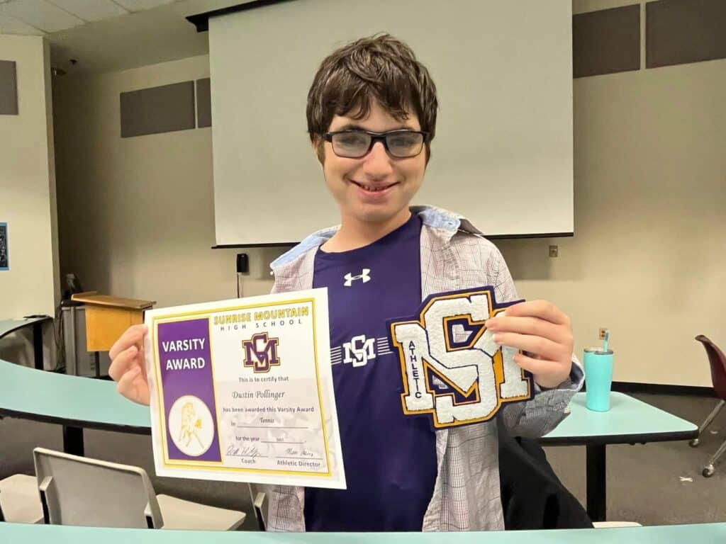 Dustin earns his varsity letter in Tennis.