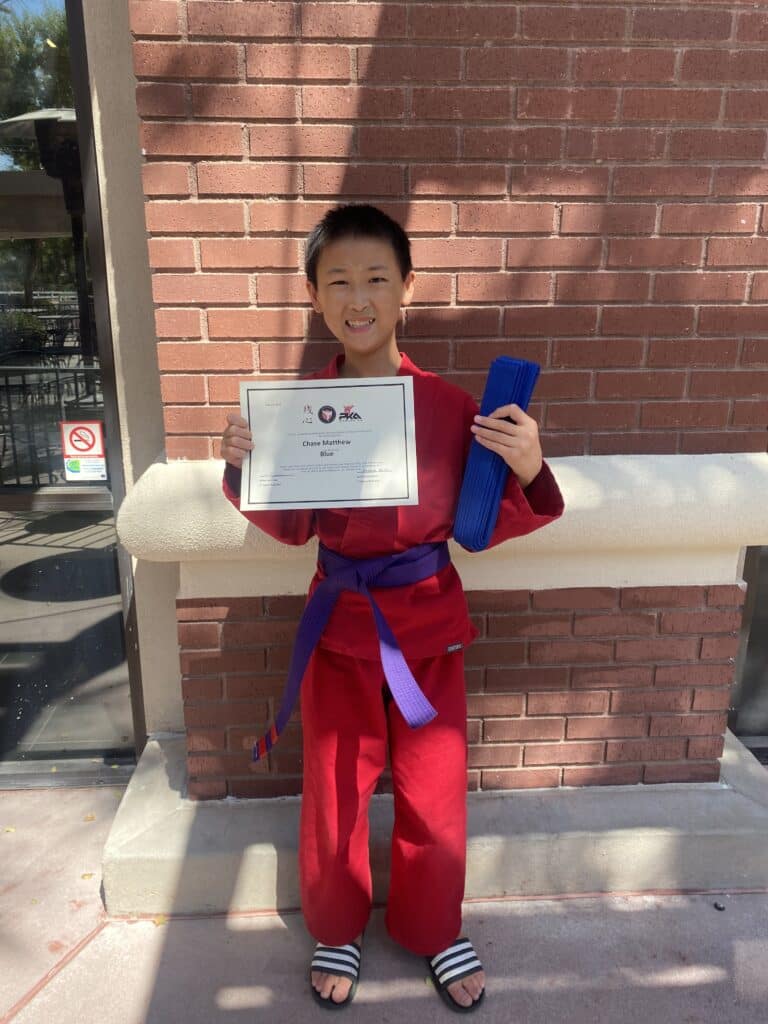 Chase earns his blue belt.